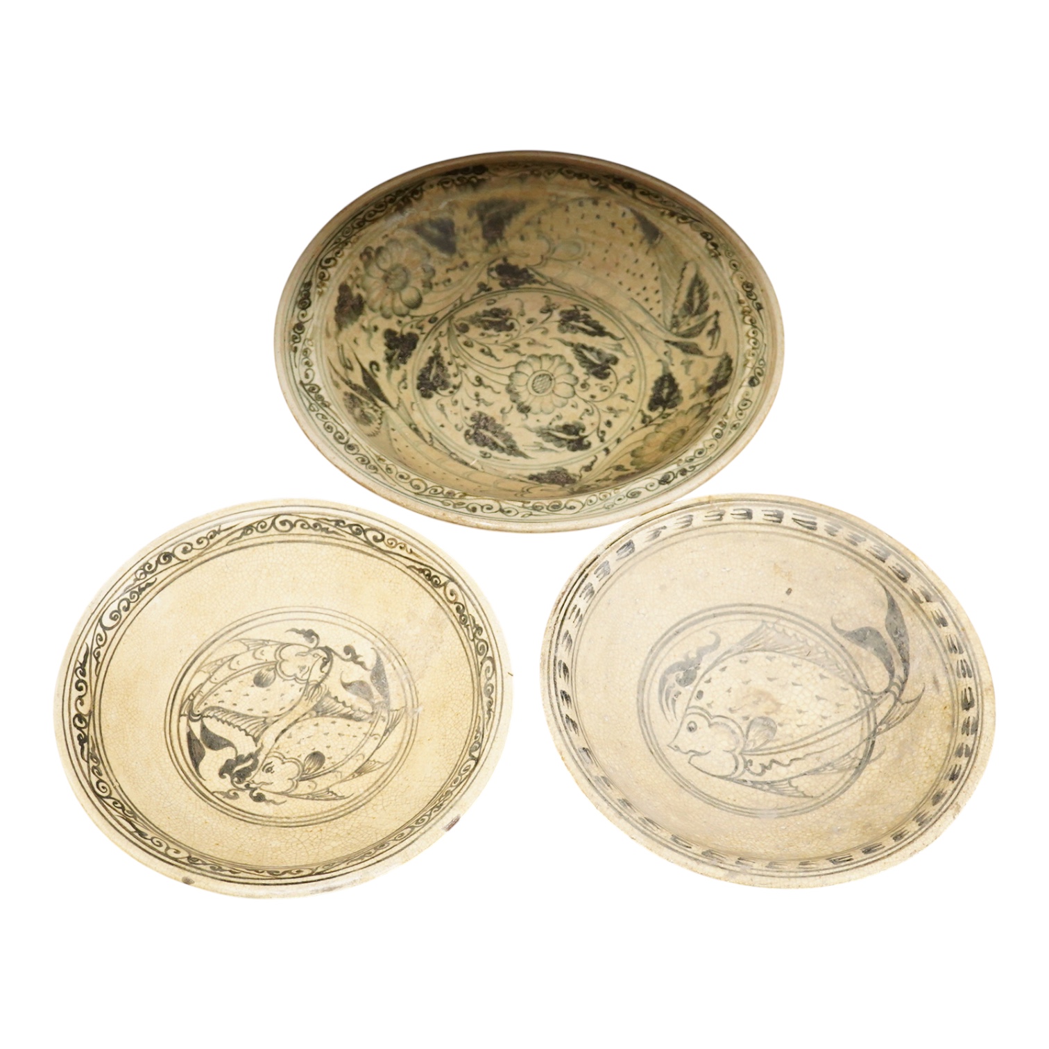 A group of three Thai underglaze blue or black crackle glaze dishes, two decorated with fish, largest 38cm in diameter